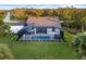 Aerial view of the property showcasing the pool and backyard at 2129 Lorraine Dr, Port Charlotte, FL 33953