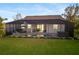 Spacious backyard with pool and screened enclosure at 2129 Lorraine Dr, Port Charlotte, FL 33953