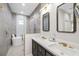 Bathroom with double vanity, shower, and soaking tub at 2129 Lorraine Dr, Port Charlotte, FL 33953