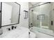 Modern bathroom with a walk-in shower and marble vanity at 2129 Lorraine Dr, Port Charlotte, FL 33953
