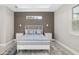 Comfortable bedroom with a white bed frame, gray bedding, and accent lighting at 2129 Lorraine Dr, Port Charlotte, FL 33953