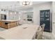 Bright dining room features a light wood table with seating for six and a view into the living area at 2129 Lorraine Dr, Port Charlotte, FL 33953