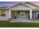 Gray and white two-story home with stone accents at 2129 Lorraine Dr, Port Charlotte, FL 33953