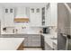Modern kitchen with white cabinets, a wood range hood, and marble countertops at 2129 Lorraine Dr, Port Charlotte, FL 33953