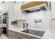 Modern kitchen with white cabinets, quartz countertops, and gold accents at 2129 Lorraine Dr, Port Charlotte, FL 33953