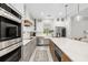 Bright kitchen with stainless steel appliances and large island at 2129 Lorraine Dr, Port Charlotte, FL 33953