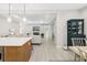 Modern kitchen boasts white and gray cabinets, marble countertops, and a farmhouse sink at 2129 Lorraine Dr, Port Charlotte, FL 33953