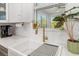 Modern kitchen with farmhouse sink and gold fixtures at 2129 Lorraine Dr, Port Charlotte, FL 33953