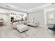 Open living room features a sectional sofa and views into the kitchen and dining area at 2129 Lorraine Dr, Port Charlotte, FL 33953