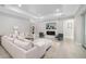 Relaxing living room with sectional sofa, fireplace, and plenty of natural light at 2129 Lorraine Dr, Port Charlotte, FL 33953