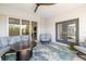 Covered patio with seating area and fire pit, perfect for relaxing at 2129 Lorraine Dr, Port Charlotte, FL 33953