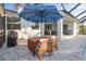 Enjoy dining alfresco on this patio with umbrella and grill at 2129 Lorraine Dr, Port Charlotte, FL 33953