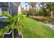 Landscaped side yard with lush greenery at 2129 Lorraine Dr, Port Charlotte, FL 33953