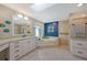 Spa-like bathroom with soaking tub, dual vanity, and skylight at 3017 Wilderness E Blvd, Parrish, FL 34219