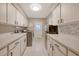 Laundry room with washer, dryer, cabinets, and countertop space at 3017 Wilderness E Blvd, Parrish, FL 34219