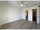 Bright bedroom featuring an ensuite bathroom, ceiling fan and closet at 3993 Lake Bayshore Dr # F513, Bradenton, FL 34205
