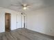 Bright bedroom featuring an ensuite bathroom, closet and ceiling fan at 3993 Lake Bayshore Dr # F513, Bradenton, FL 34205