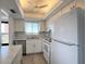 A kitchen with a view that also includes a stainless steel dishwasher and a ceiling fan at 3993 Lake Bayshore Dr # F513, Bradenton, FL 34205