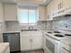 Kitchen with stone counter tops, stainless steel appliances and a window at 3993 Lake Bayshore Dr # F513, Bradenton, FL 34205