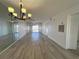 Living room area with light hardwood floor and a balcony view at 3993 Lake Bayshore Dr # F513, Bradenton, FL 34205