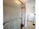 Tiled shower with glass sliding doors and decorative trim in the shower at 3993 Lake Bayshore Dr # F513, Bradenton, FL 34205