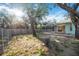 View of backyard with mature trees and view of home's screened pool at 611 Mobile Rd, Venice, FL 34293