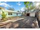 The backyard features a detached garage and plenty of open space at 611 Mobile Rd, Venice, FL 34293