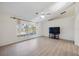 Bright Living room with vaulted ceilings, ceiling fan, and light wood floors at 611 Mobile Rd, Venice, FL 34293