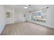 Spacious living room featuring vaulted ceilings, light wood flooring, and large window at 611 Mobile Rd, Venice, FL 34293