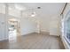 Open-concept living room leading to a pool through a sliding glass door at 611 Mobile Rd, Venice, FL 34293