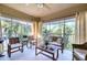 Spacious screened balcony, wicker furniture, lovely view at 6311 Grand Oak Cir # 202, Bradenton, FL 34203