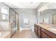 Spa-like bathroom with double vanity and large walk-in shower at 655 Resolute St, Nokomis, FL 34275