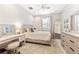 Charming bedroom with vanity and full-size bed at 655 Resolute St, Nokomis, FL 34275