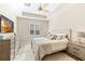Bright bedroom with king bed, large TV and ample closet space at 655 Resolute St, Nokomis, FL 34275