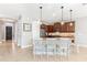 Modern kitchen with granite countertops and dark wood cabinets at 655 Resolute St, Nokomis, FL 34275