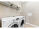 Functional laundry room with washer and dryer at 655 Resolute St, Nokomis, FL 34275