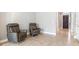 Bright living room with two comfy recliner chairs at 655 Resolute St, Nokomis, FL 34275