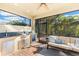 Outdoor kitchen with grill and seating area at 655 Resolute St, Nokomis, FL 34275