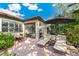 Relaxing patio with lounge chairs and umbrella at 655 Resolute St, Nokomis, FL 34275