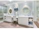 Elegant bathroom with double vanity, large mirror, and a walk-in shower at 915 Seaside Dr # 407, Sarasota, FL 34242
