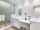 Bright bathroom with double vanity and a walk-in shower at 915 Seaside Dr # 407, Sarasota, FL 34242