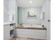 Relaxing bathroom with soaking tub and a calming color scheme at 915 Seaside Dr # 407, Sarasota, FL 34242