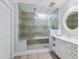 Spa-like bathroom with a large walk-in shower and glass enclosure at 915 Seaside Dr # 407, Sarasota, FL 34242