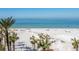 Aerial view of pristine beach with palm trees at 915 Seaside Dr # 407, Sarasota, FL 34242