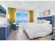 Main bedroom with stunning ocean view and comfortable furnishings at 915 Seaside Dr # 407, Sarasota, FL 34242