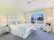 Spacious bedroom with ocean views and soft color palette at 915 Seaside Dr # 407, Sarasota, FL 34242