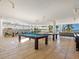 Relaxing game room with billiard and ping pong tables at 915 Seaside Dr # 407, Sarasota, FL 34242