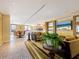 Relaxing lobby area with seating, a large TV, and a coffee bar at 915 Seaside Dr # 407, Sarasota, FL 34242