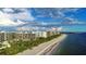 Aerial view of beachfront condo building, showing the community and ocean at 535 Sanctuary Dr # A202, Longboat Key, FL 34228