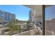 Balcony with partial ocean view and seating for multiple people at 535 Sanctuary Dr # A202, Longboat Key, FL 34228